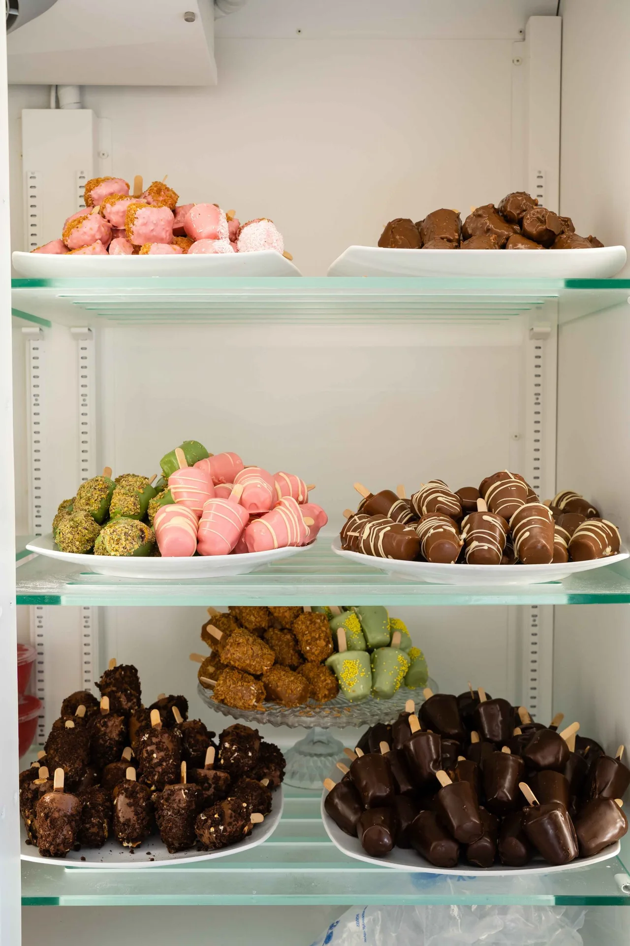 Shelves of chocolate-dipped strawberries, truffles and handmade sweets